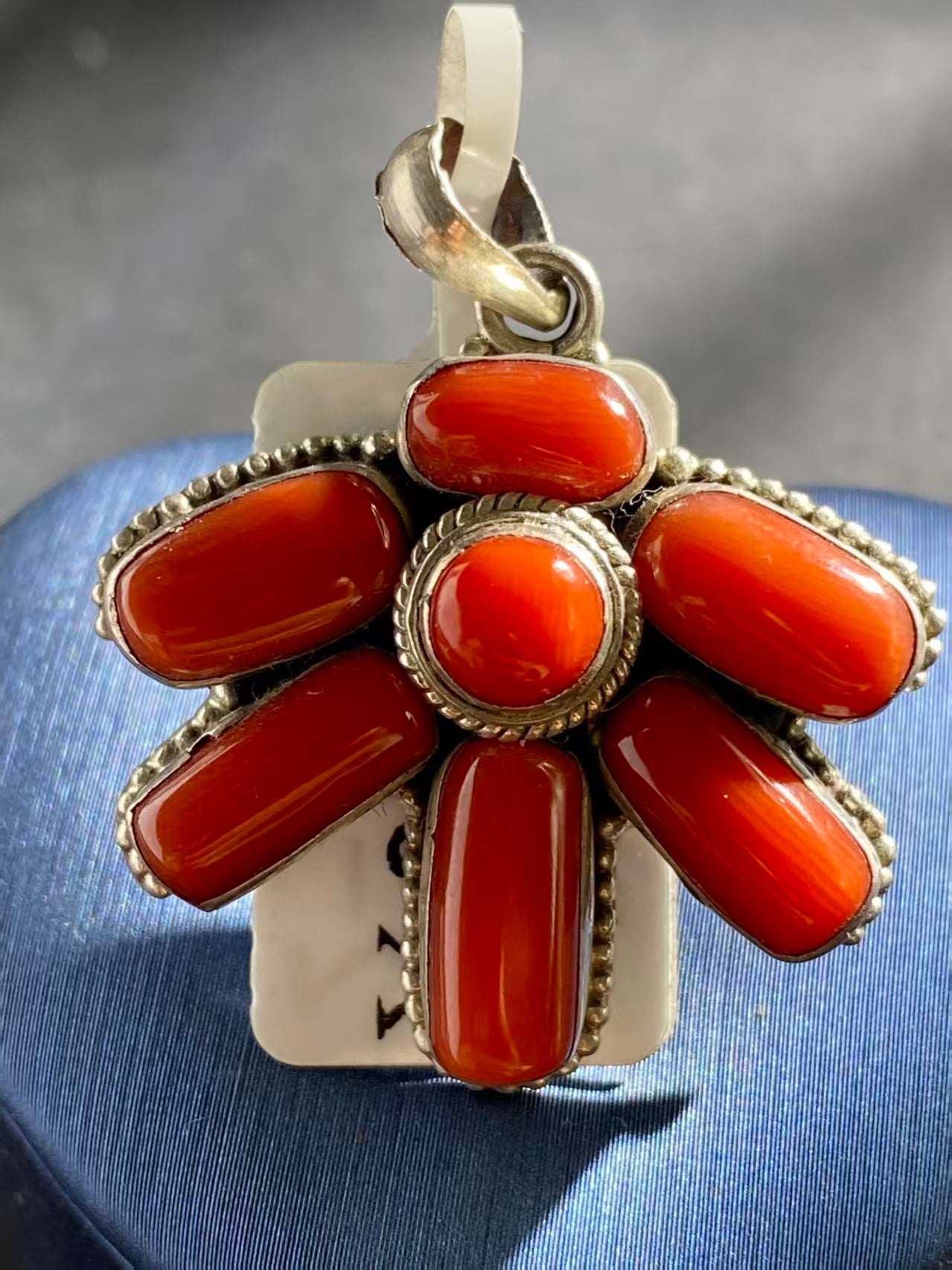 Traditional red pendant reflecting Tibetan Buddhist cultural artistry. A timeless, handcrafted piece symbolizing peace, balance, and spiritual enlightenment.