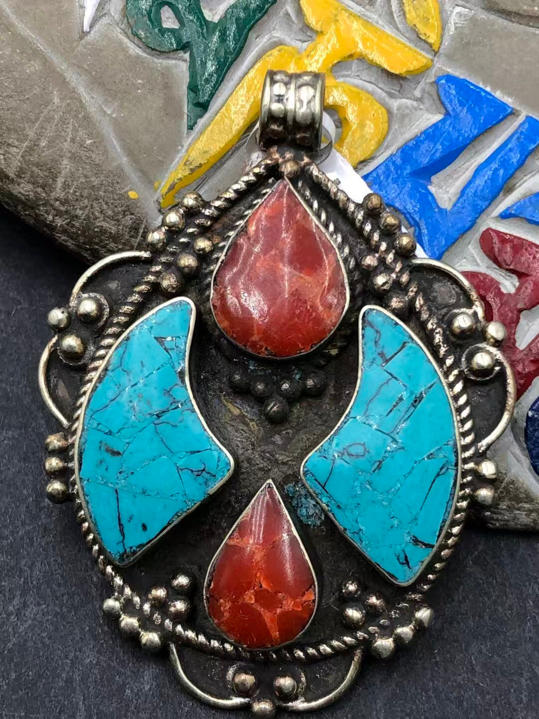 Turquoise inlay pendant with hand-painted design, embodying Tibetan Buddhist art. A spiritually significant piece, perfect for meditation and everyday wear.