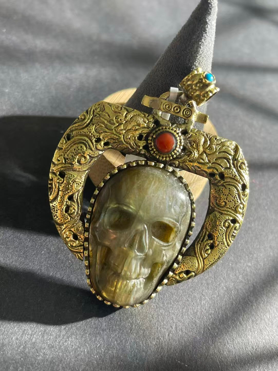 Traditional Labradorite pendant handcrafted with Tibetan Buddhist influences. This pendant enhances spiritual growth, intuition, and balance with its unique design.