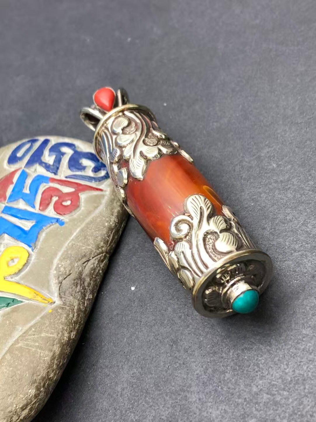 Pure handcrafted red agate pendant, embodying Tibetan Buddhist symbolism. Known for its healing properties and energy protection, ideal for spiritual practices.