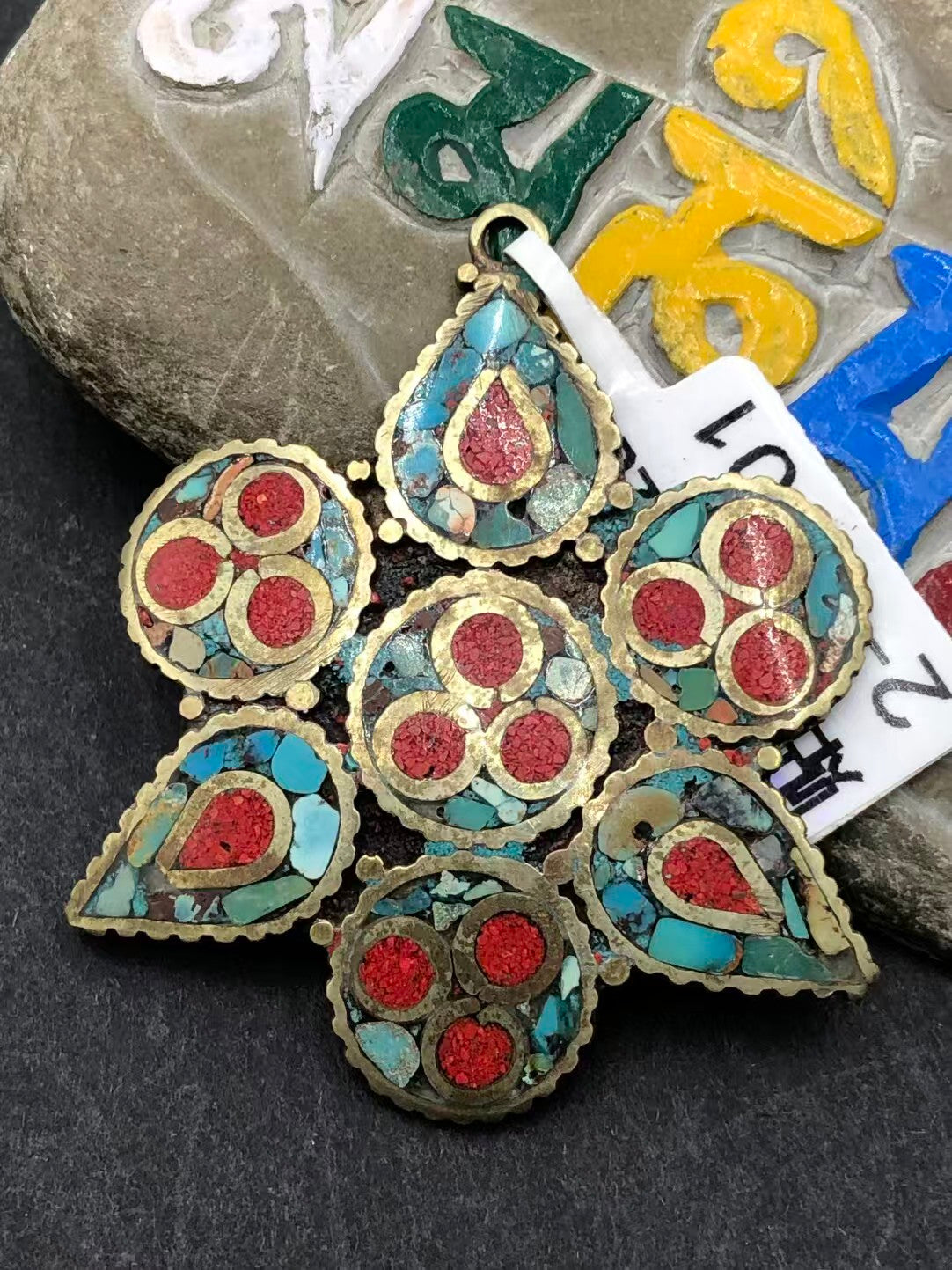 Handcrafted retro patch pendant with Tibetan Buddhist influences. A beautiful fusion of spirituality and vintage style, adding elegance and meaning to your look.