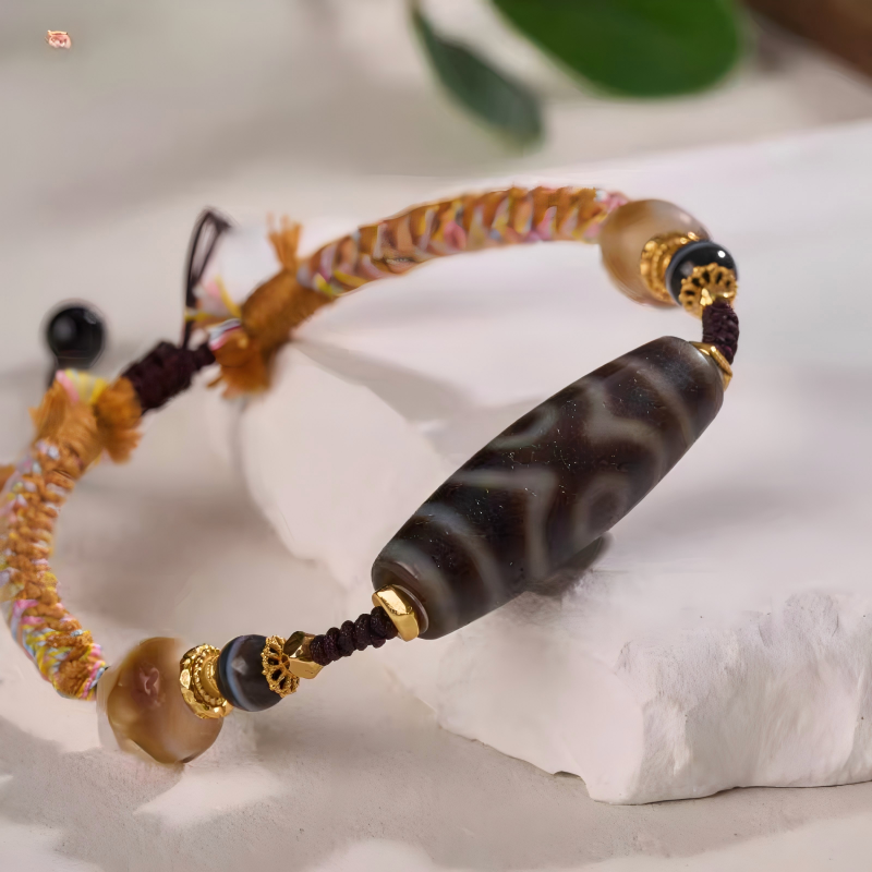 thnic style Panda Three-Eye Dzi bracelet, handcrafted with Tibetan Buddhist jewelry culture, combining spiritual symbolism and artisan craftsmanship.