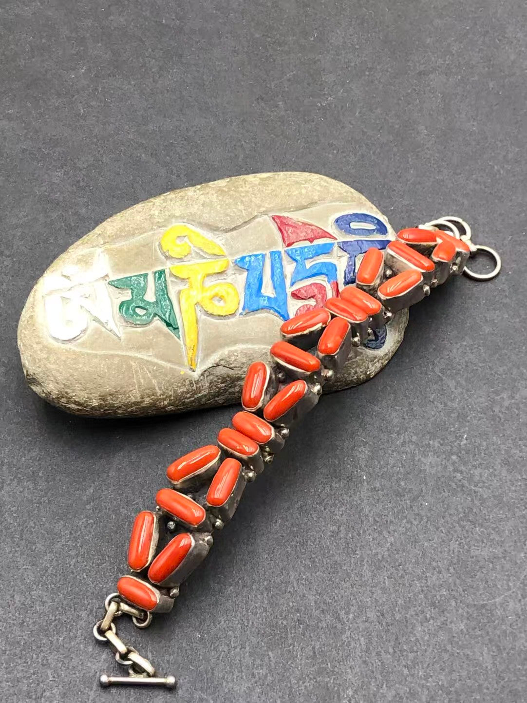 Handcrafted red plastic bead bracelet, infused with Tibetan Buddhist jewelry culture and artistry, offering a unique piece that blends tradition and modern design.