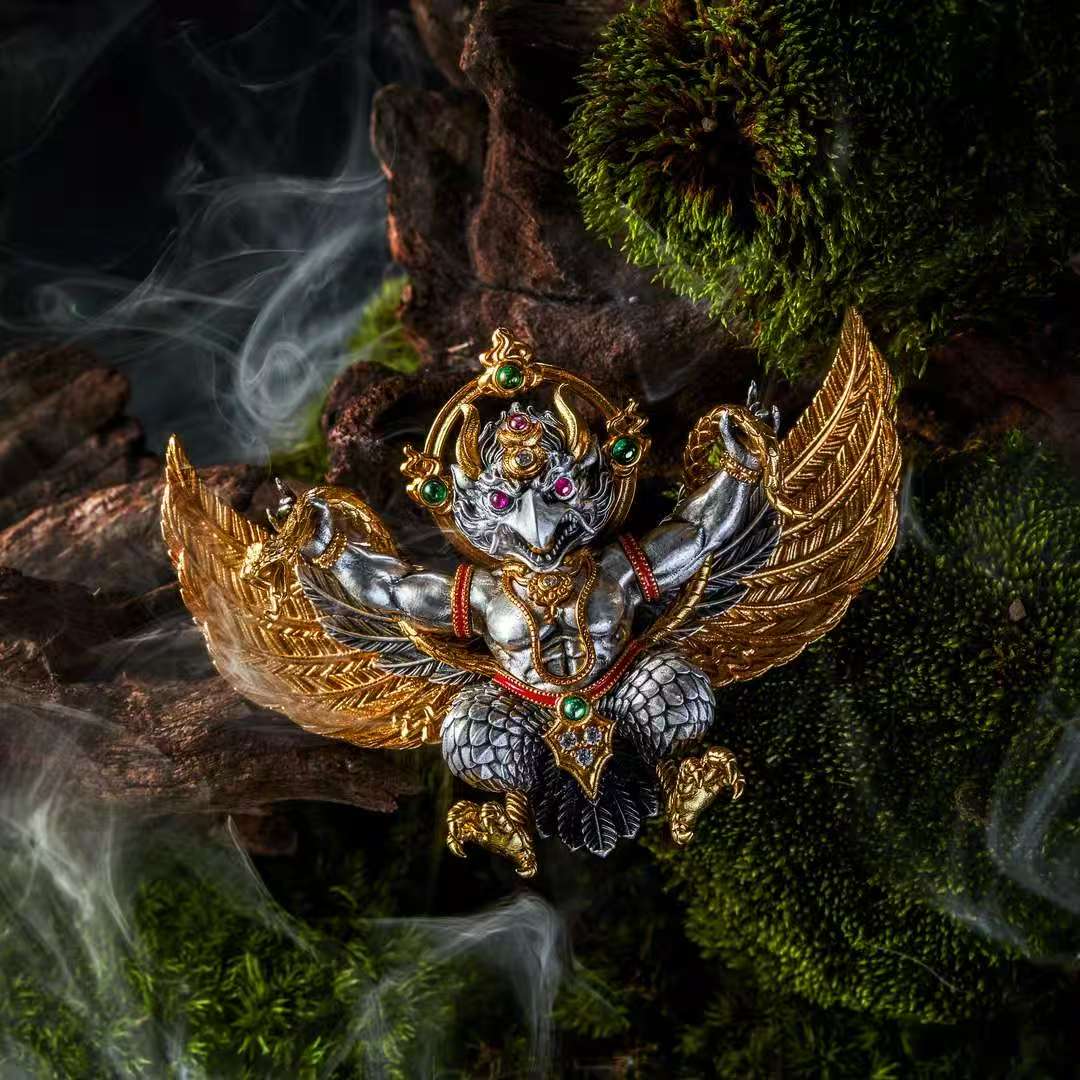 Sacred Garuda bird silver pendant from Tibetan Buddhist jewelry culture, traditional jewelry art for spiritual protection.