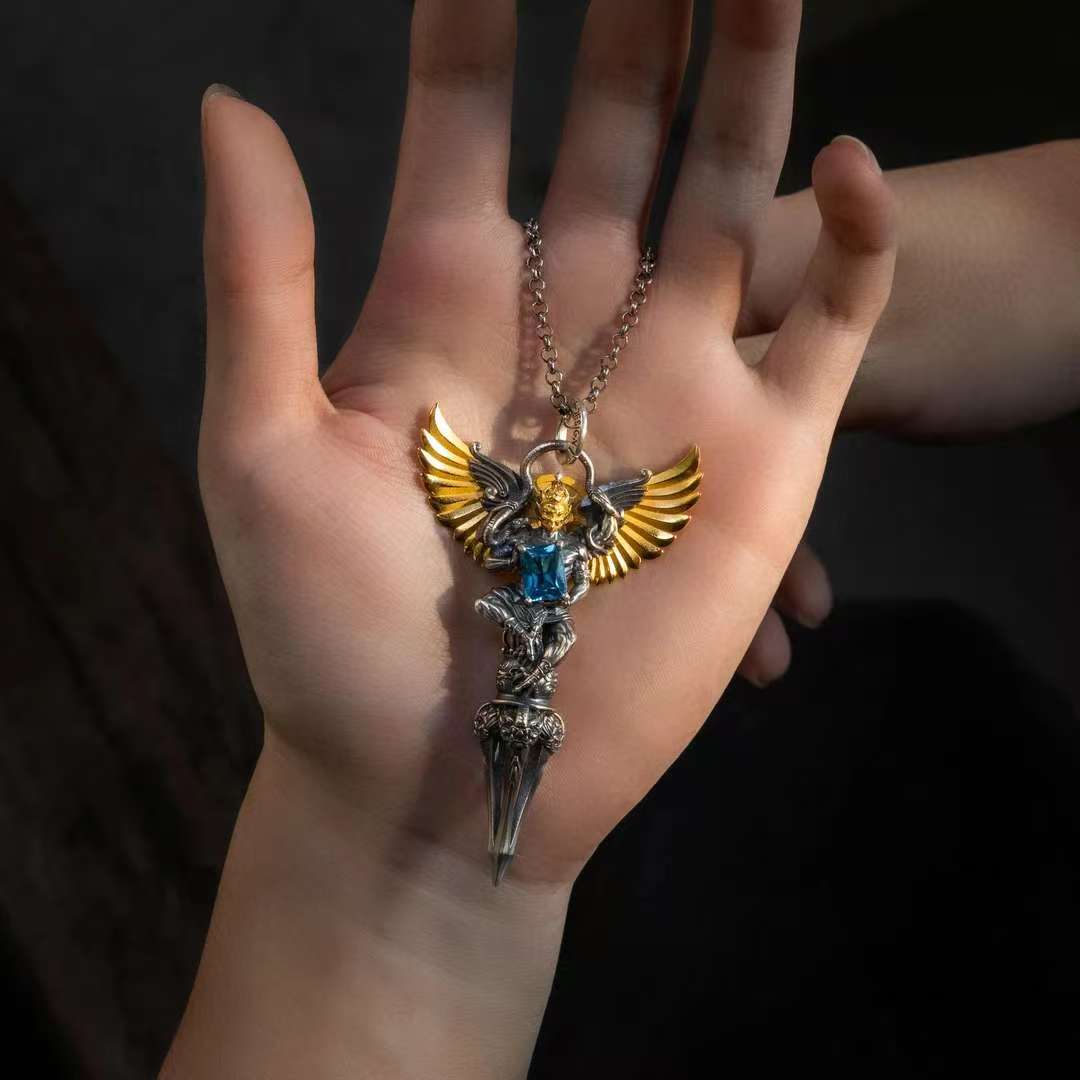 Tibetan silver Garuda phurba amulet handcrafted in Tibetan Buddhist jewelry culture, symbolic jewelry art.