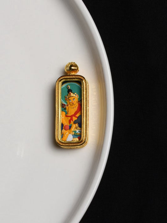 Traditional Yellow Jambhala Buddhist pendant, hand-painted jewelry art for prosperity and spiritual balance.