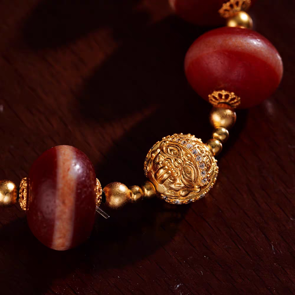 Ethnic style red coral Medicine Buddha bead bracelet, handcrafted for spiritual significance, traditional Tibetan jewelry art, and everyday wear.