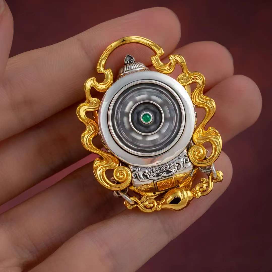 Tibetan Buddhist Yellow Jambhala wealth deity silver pendant, handcrafted jewelry art for protection and prosperity.