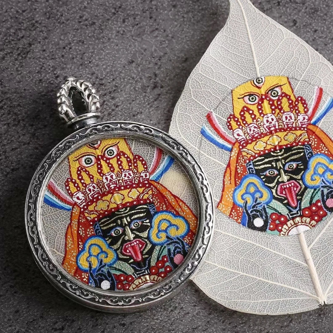 Spiritual Zaki Lam Yellow Wealth Buddha Thangka pendant necklace with Blue Bodhi Leaf hand-painted details, symbolizing Buddhist blessings and wealth