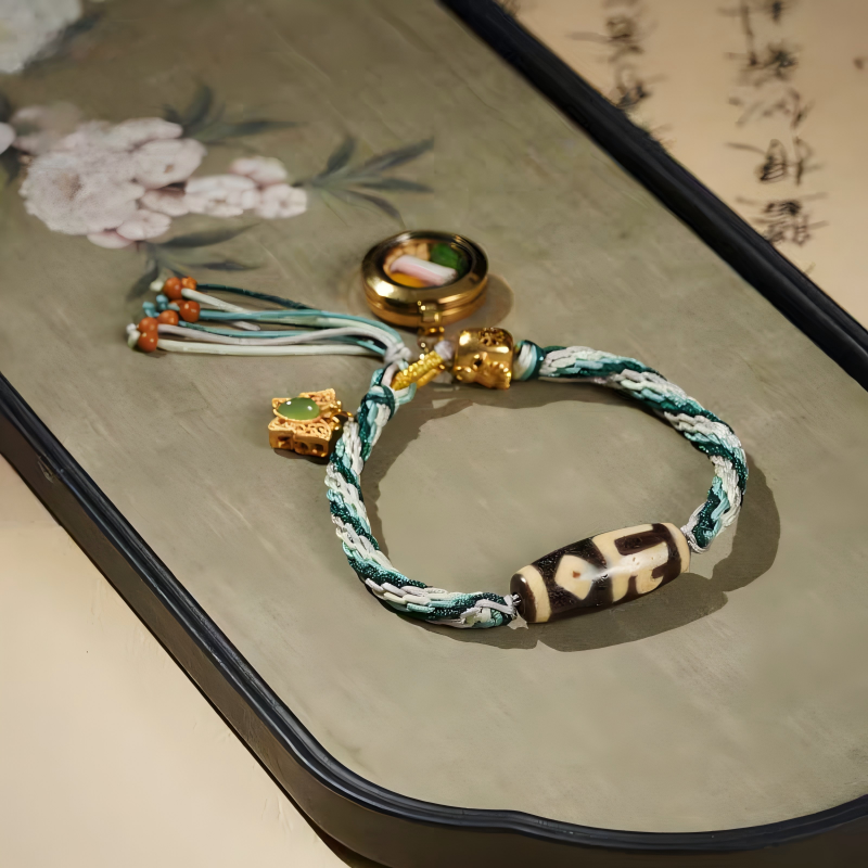Authentic Tibetan Ten-Aspects Yellow Jambhala talisman bracelet, handcrafted for meditation, protection, and prosperity, reflecting jewelry art.