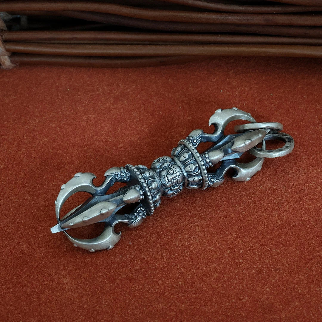 Tibetan-style silver Dorje pendant, a meaningful Buddhist jewelry art piece for meditation and daily wear.