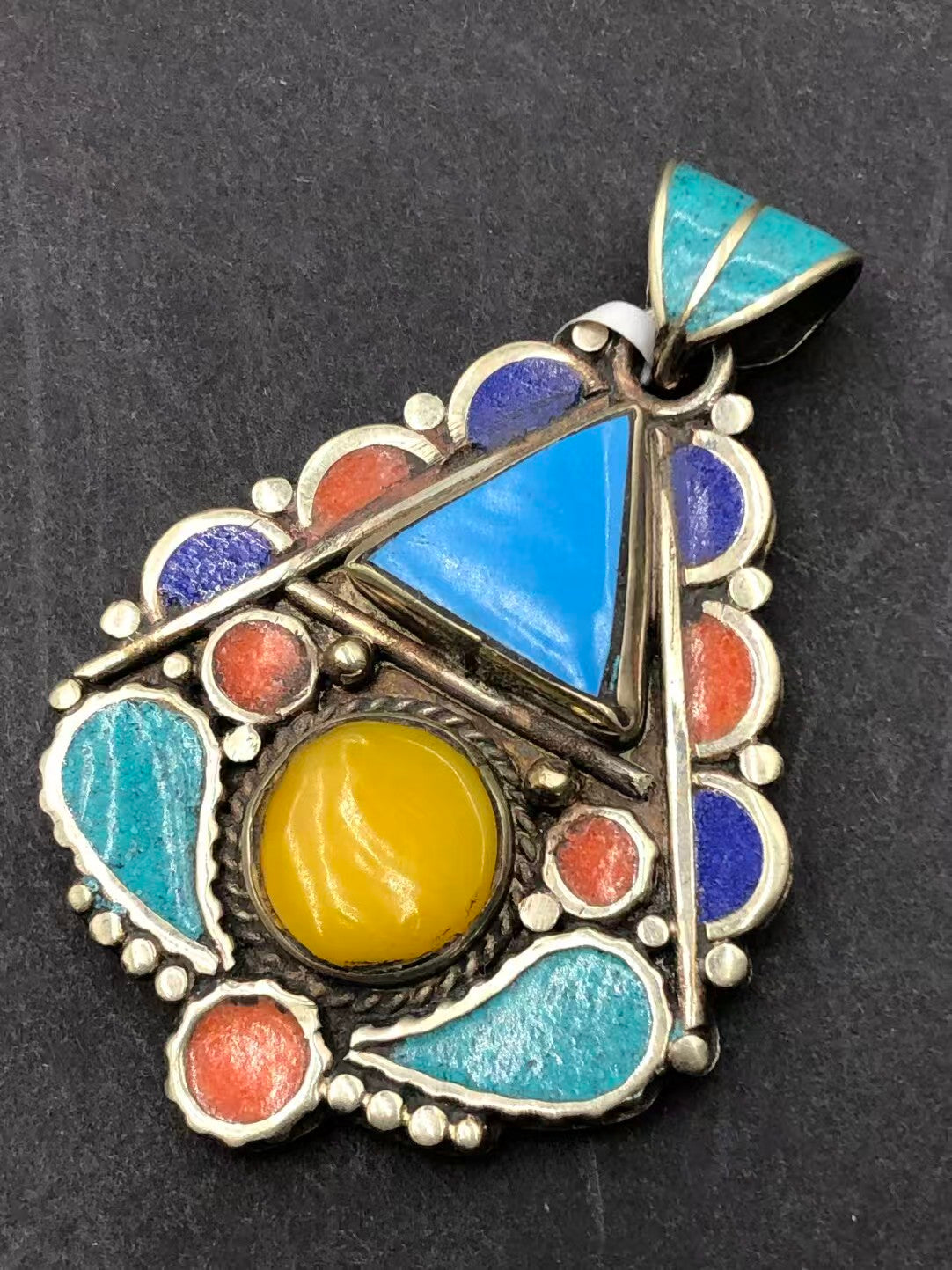 Traditional honey wax inlay pendant with Tibetan Buddhist artistry. A unique spiritual piece promoting calm, protection, and inner harmony.
