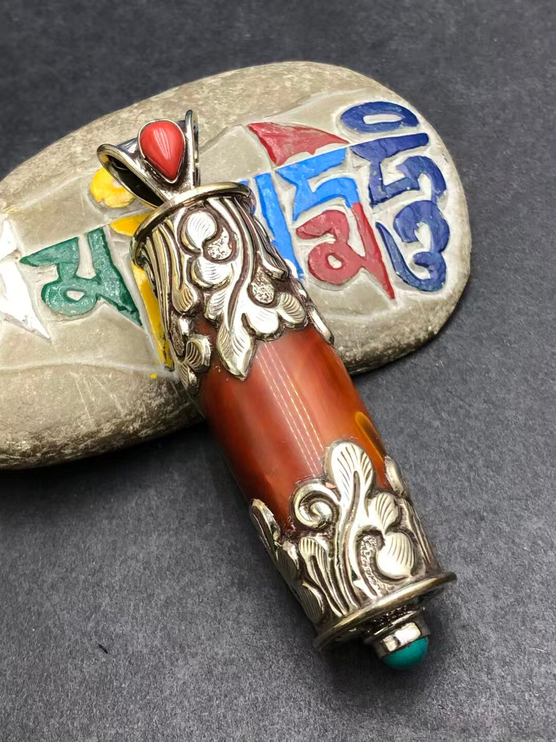 Unique handcrafted red agate pendant with Tibetan Buddhist artistic influence. Perfect for meditation, spiritual growth, and protection against negative energy.