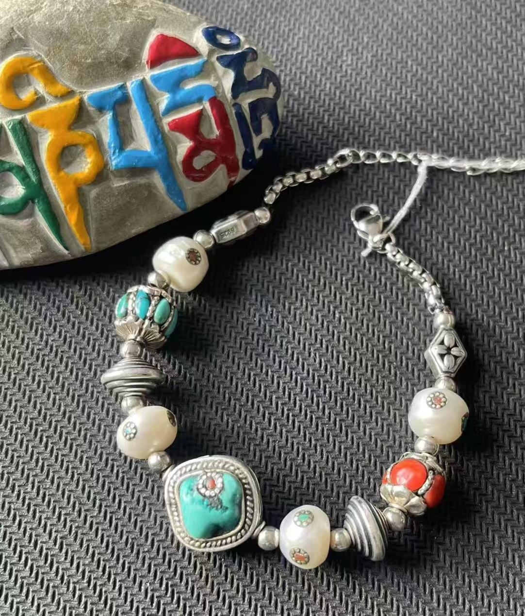 Artistic multi-treasure bracelet, combining Tibetan Buddhist jewelry culture and intricate craftsmanship, symbolizing spiritual richness and timeless beauty.
