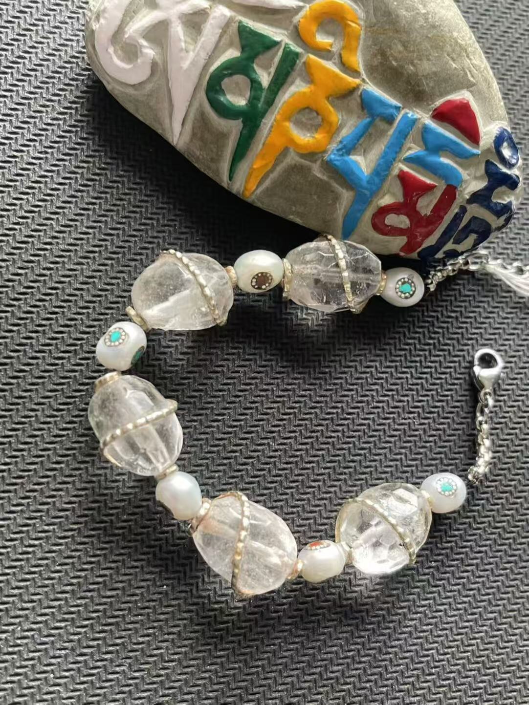 A stunning red patchwork floral bracelet from Tibetan Buddhist jewelry culture, blending traditional design with modern elements for a unique look.