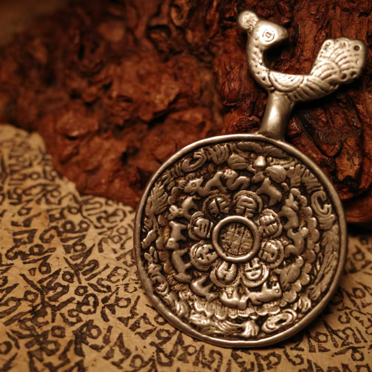 Tibetan Peacock Wisdom Deity Nine Palace Bagua amulet, handmade and hand-painted Jewelry art rooted in Tibetan Buddhist Jewelry Culture for spiritual protection and energy balance.