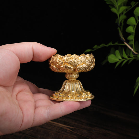 Handcrafted brass lotus candle holder for altar use, rooted in Tibetan Buddhist ritual implements culture and refined Buddhist ritual implements art