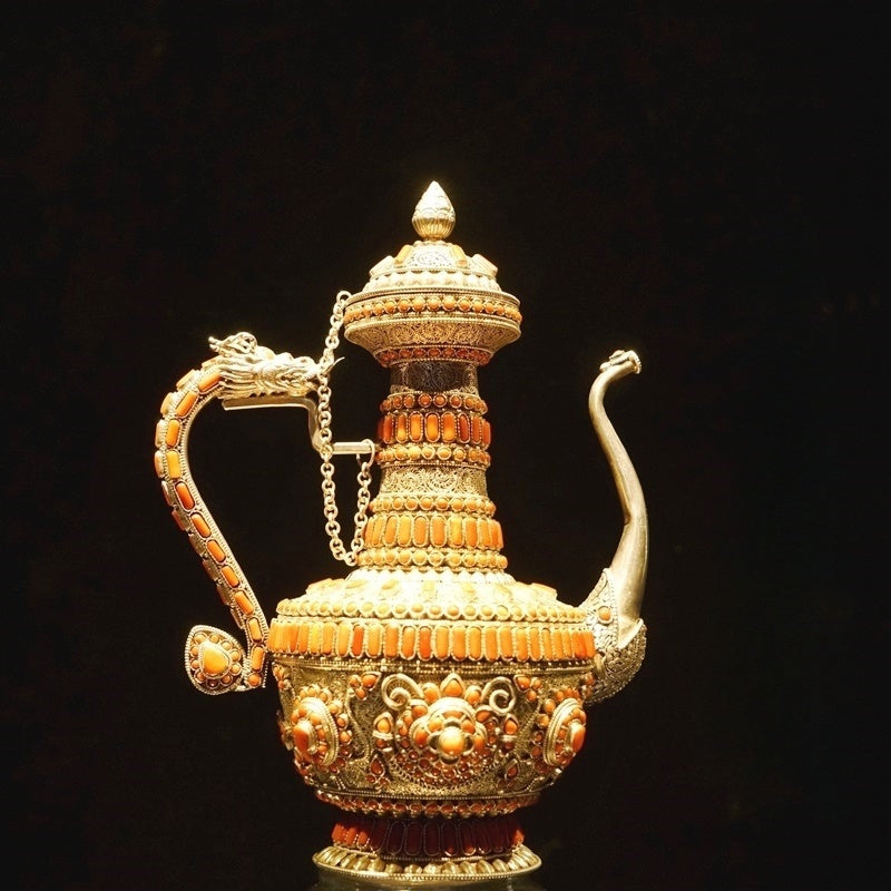 Traditional coral-inlaid pure silver water purifier, handmade in Tibetan Buddhist ritual implements culture and presented as authentic Buddhist ritual implements art.