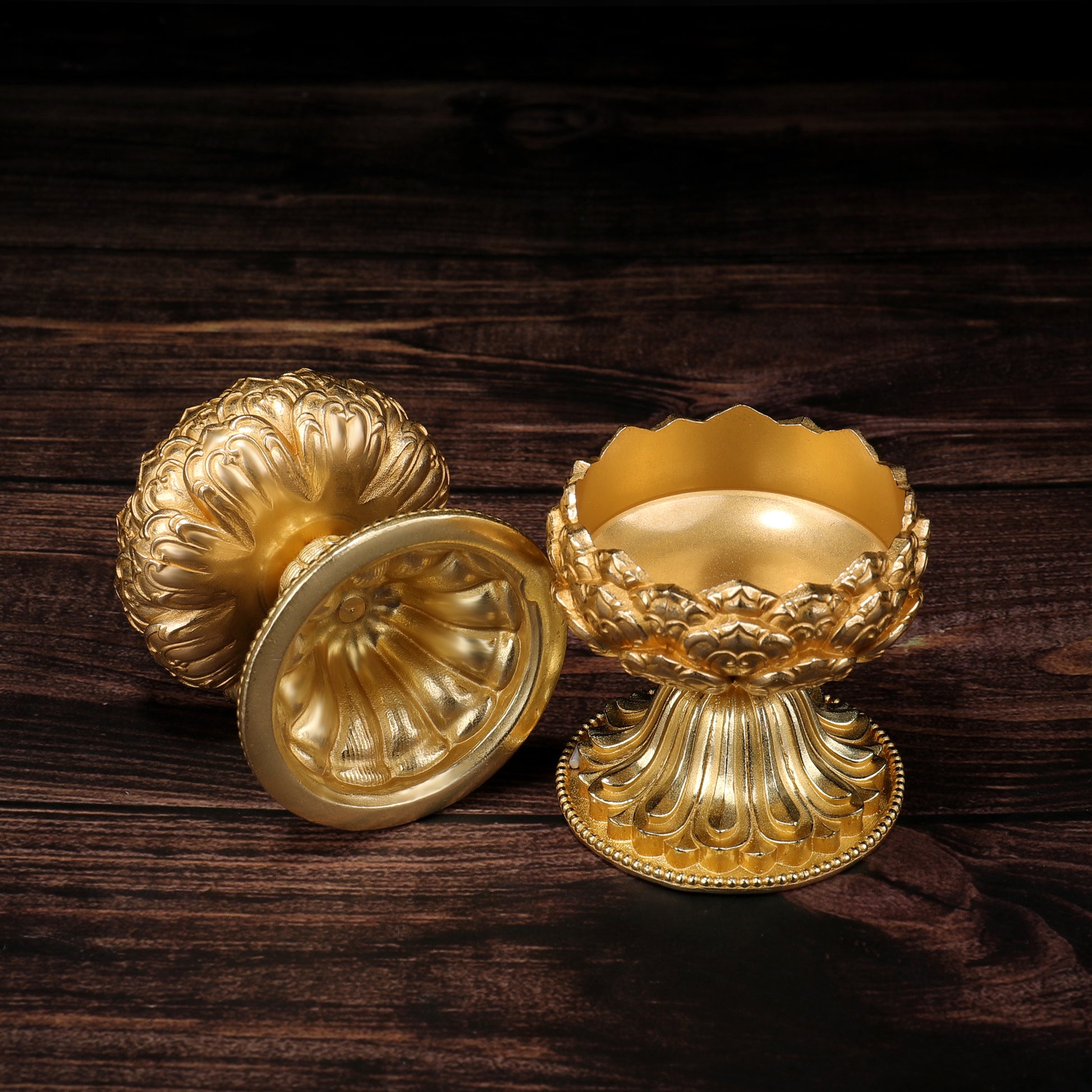 Traditional brass lotus offering candle stand used in Tibetan Buddhist rituals, reflecting Tibetan Buddhist ritual implements culture and Buddhist ritual implements art