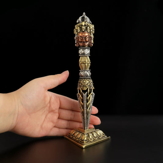This handcrafted 21cm large three-sided Purba Vajra Dagger is made from premium brass, copper, and white copper. It is an essential Tibetan Buddhist ritual implement, perfect for meditation, spiritual rituals, and sacred spaces.