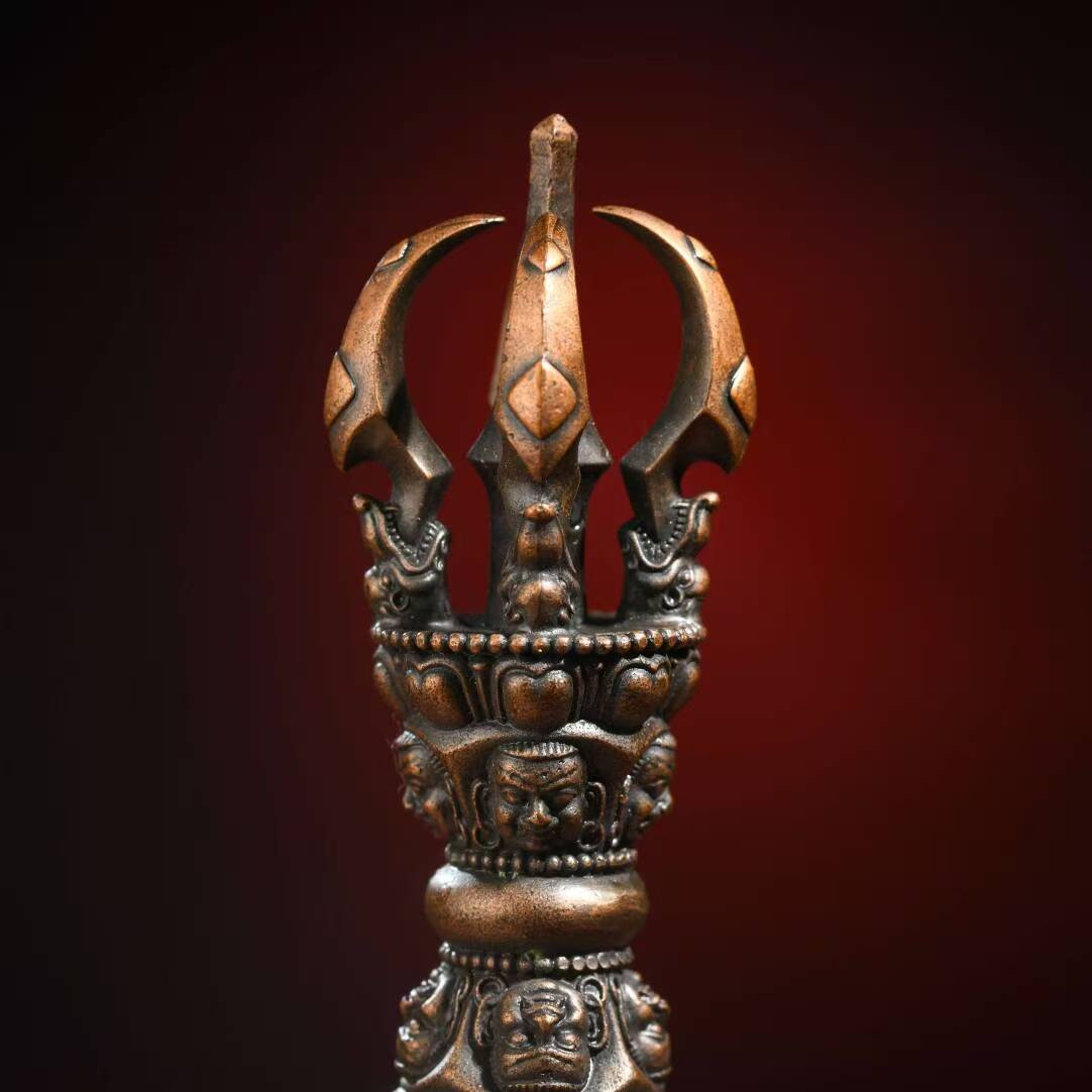 Handcrafted brass Phurba Vajra in Tibetan Buddhist ritual implements culture, symbolizing protection and spiritual power.