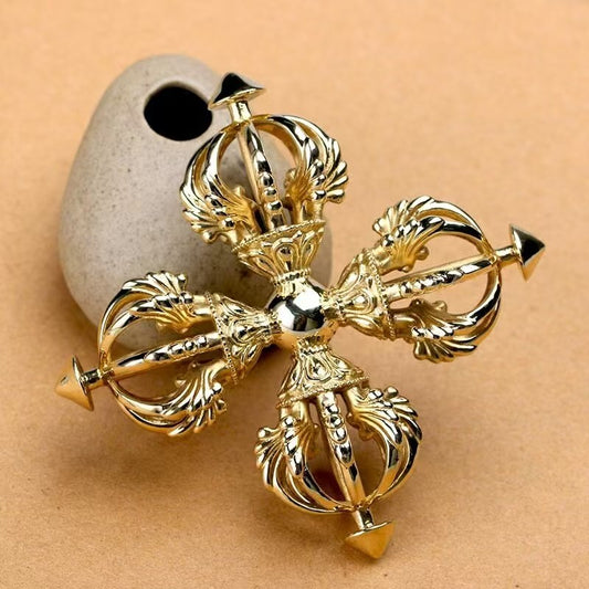 Handcrafted Brass Nine-Prong Cross Vajra, symbolizing spiritual strength, wisdom, and protection in Tibetan Buddhism. Perfect for rituals, meditation, and home decor