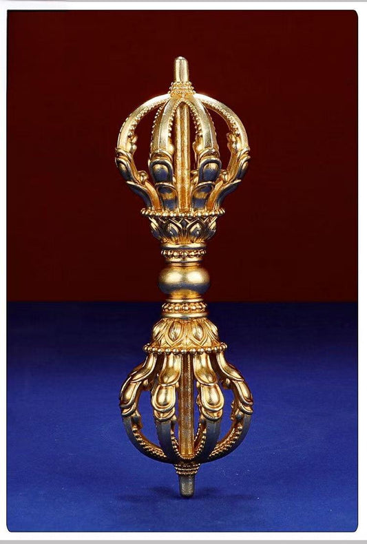 This meticulously handcrafted Brass Five-Pronged Vajra embodies the strength and protection of Tibetan Buddhist traditions. Ideal for spiritual practices, meditation, or as a decorative piece, it symbolizes the removal of obstacles and the firm establishment of sacred energy. Crafted with care and precision, this stunning piece enhances any sacred space or altar.