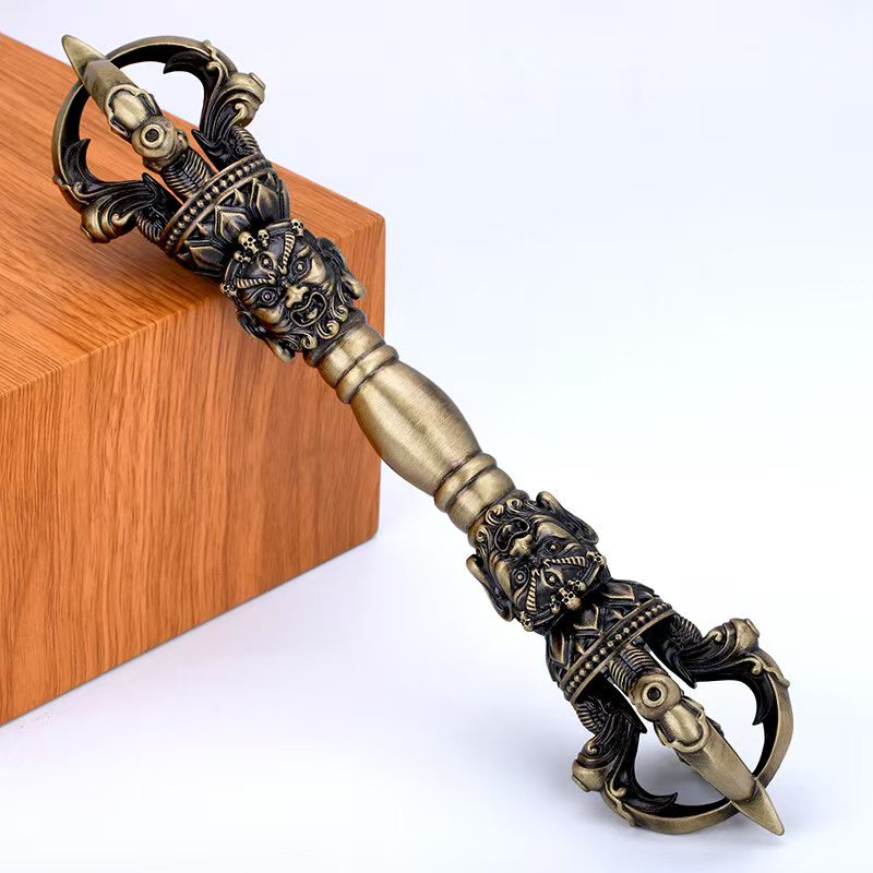 A beautifully handcrafted brass Five-Pronged Vajra, a symbol of protection and wisdom in Tibetan Buddhism. Perfect for use in rituals, meditation, and spiritual practices.