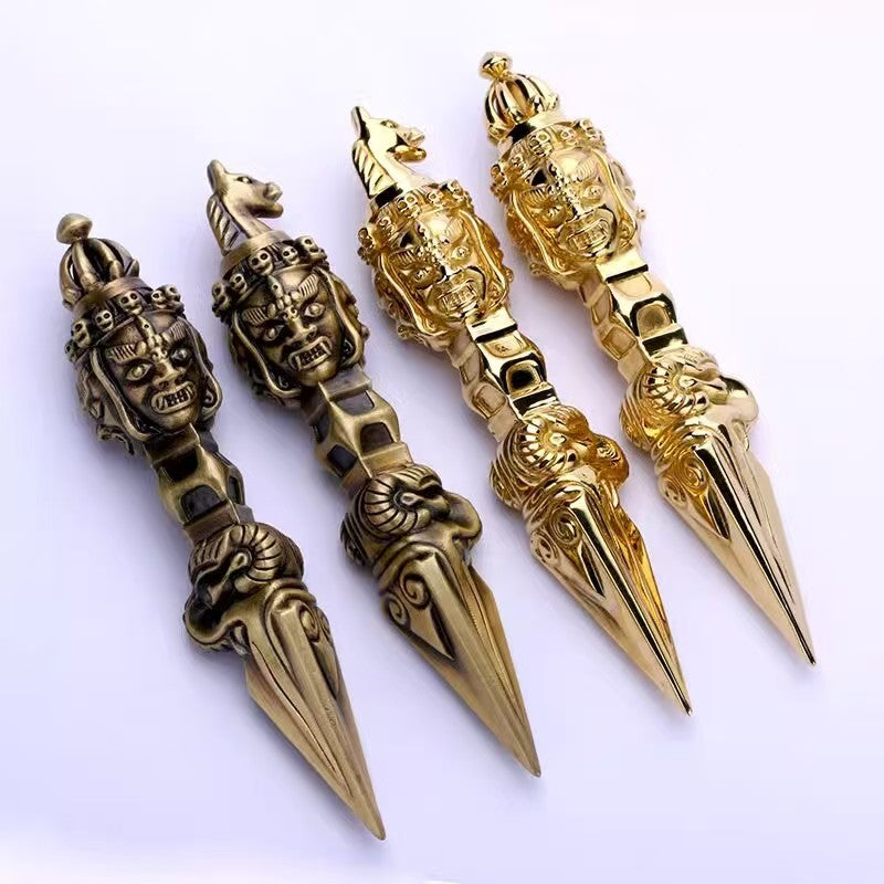 Handcrafted brass Mahakala Phurba Vajra, symbolizing spiritual protection and transformation. A powerful ritual tool and sacred art piece for Tibetan Buddhist practices.