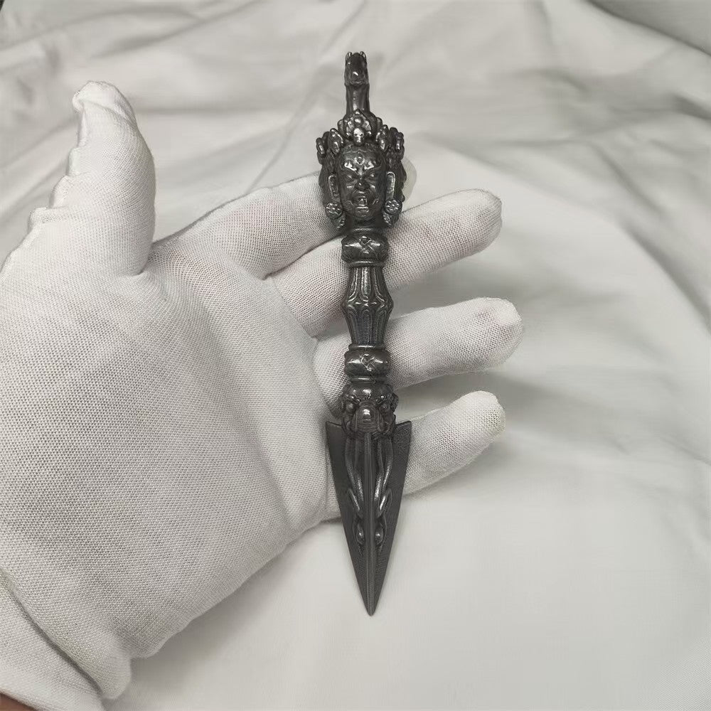 Handcrafted brass Mahakala Vajra inspired by Tibetan Buddhist ritual implements culture, symbolizing powerful protection and sacred Buddhist ritual art.