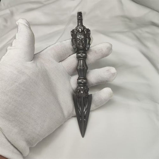 Handcrafted brass Mahakala Vajra inspired by Tibetan Buddhist ritual implements culture, symbolizing powerful protection and sacred Buddhist ritual art.