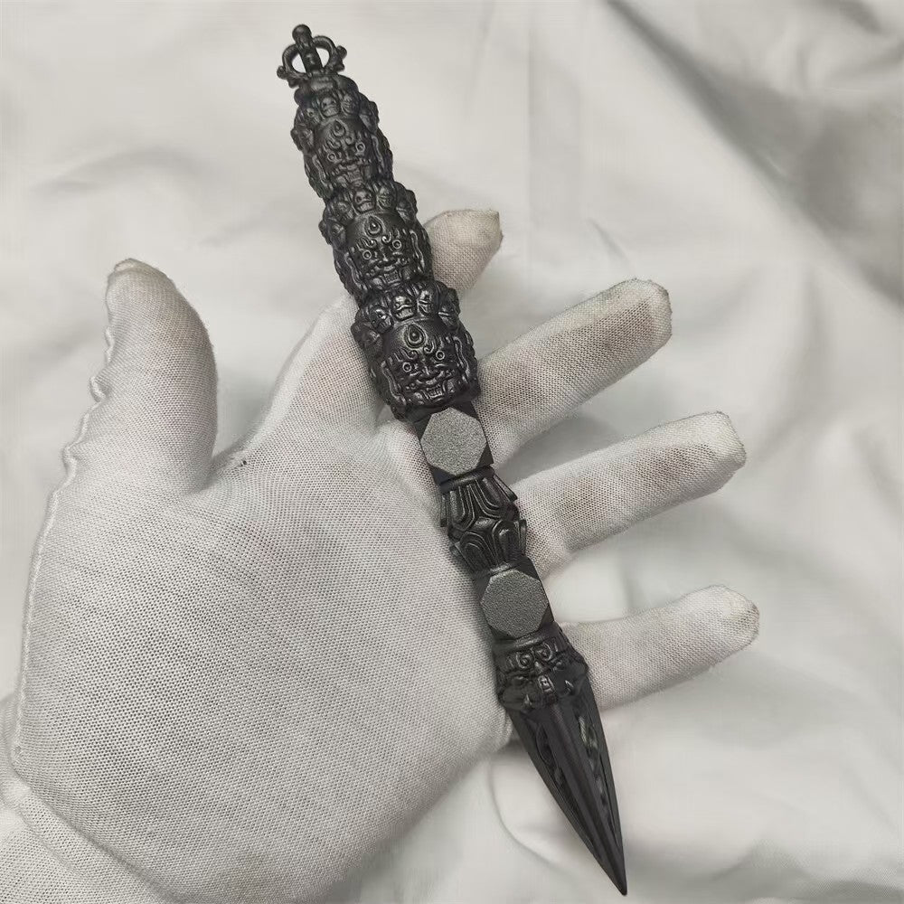 Handcrafted brass Nine-Headed Phurba, inspired by Tibetan Buddhist ritual implements culture, symbolizing purification, spiritual protection, and transformation in rituals.