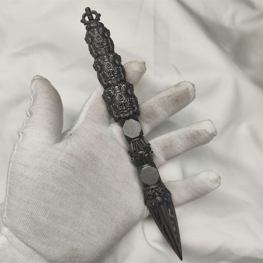 Handcrafted brass Nine-Headed Phurba, inspired by Tibetan Buddhist ritual implements culture, symbolizing purification, spiritual protection, and transformation in rituals.