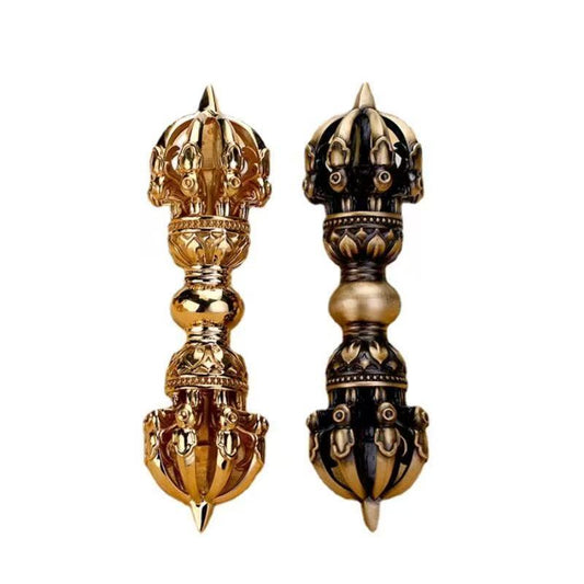 Handcrafted Brass Nine-Prong Vajra with Bell, symbolizing protection, strength, and spiritual wisdom in Tibetan Buddhism. A perfect piece for rituals and meditation.