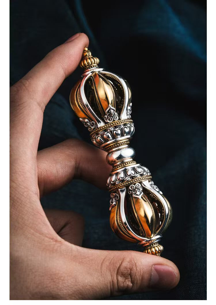 Handheld Brass Nine-Prong Vajra, used for demon subduing in Tibetan Buddhist rituals. A sacred tool representing protection, wisdom, and spiritual empowerment.