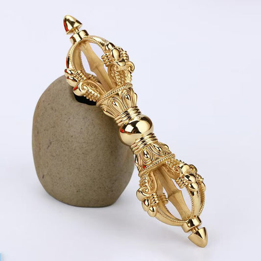 Handcrafted brass Five-Pronged Vajra, a sacred Tibetan Buddhist ritual tool used for protection, purification, and spiritual enlightenment. Ideal for meditation, rituals, and spiritual spaces.