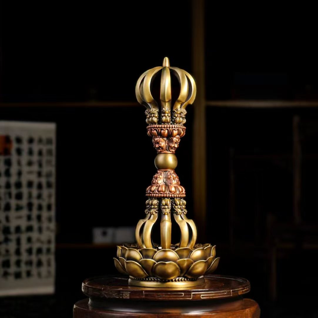 Handcrafted Brass Nine-Pronged Vajra, used in Tibetan Buddhist rituals for protection. A sacred artifact for spiritual purification and positive energy.