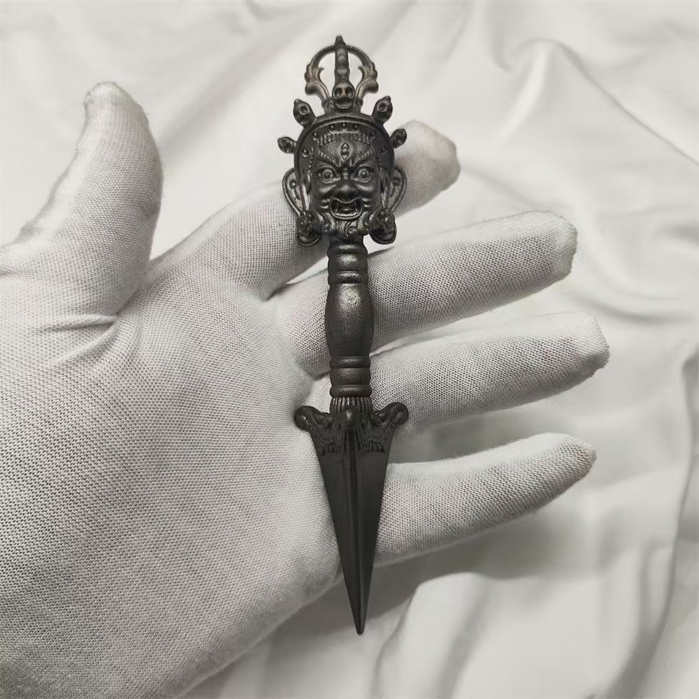 Handmade brass Vajra Phurba, representing spiritual power and purification, used in East Tibetan Buddhist rituals to eliminate obstacles and protect the practitioner.