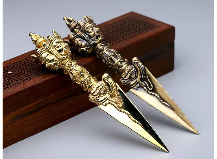 Handcrafted brass Phurba Vajra from Tibetan Buddhist ritual implements culture, powerful Buddhist ritual implements art symbolizing protection and spiritual strength.