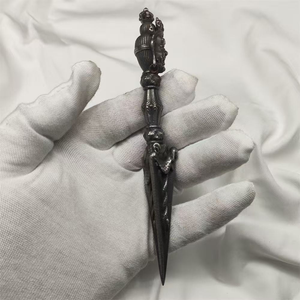 Handcrafted brass Phurba Vajra from Tibetan Buddhist ritual implements culture, symbolizing protection, power, and sacred Buddhist ritual art.