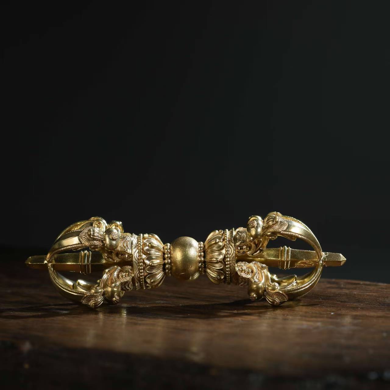 This brass five-pronged Phurba Vajra is meticulously handcrafted using traditional Nepalese techniques. Ideal for purification and protection, it serves as a powerful tool for your Tibetan Buddhist practices and home altars.