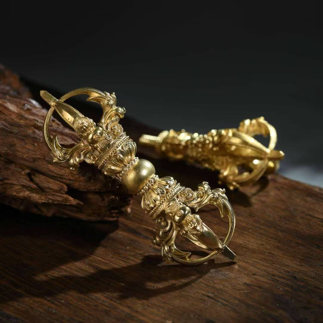 The brass five-pronged Phurba Vajra is an essential tool for Tibetan Buddhist rituals. Handcrafted in Nepal, it represents spiritual strength, purification, and demon-slaying energy, perfect for meditation and altars.