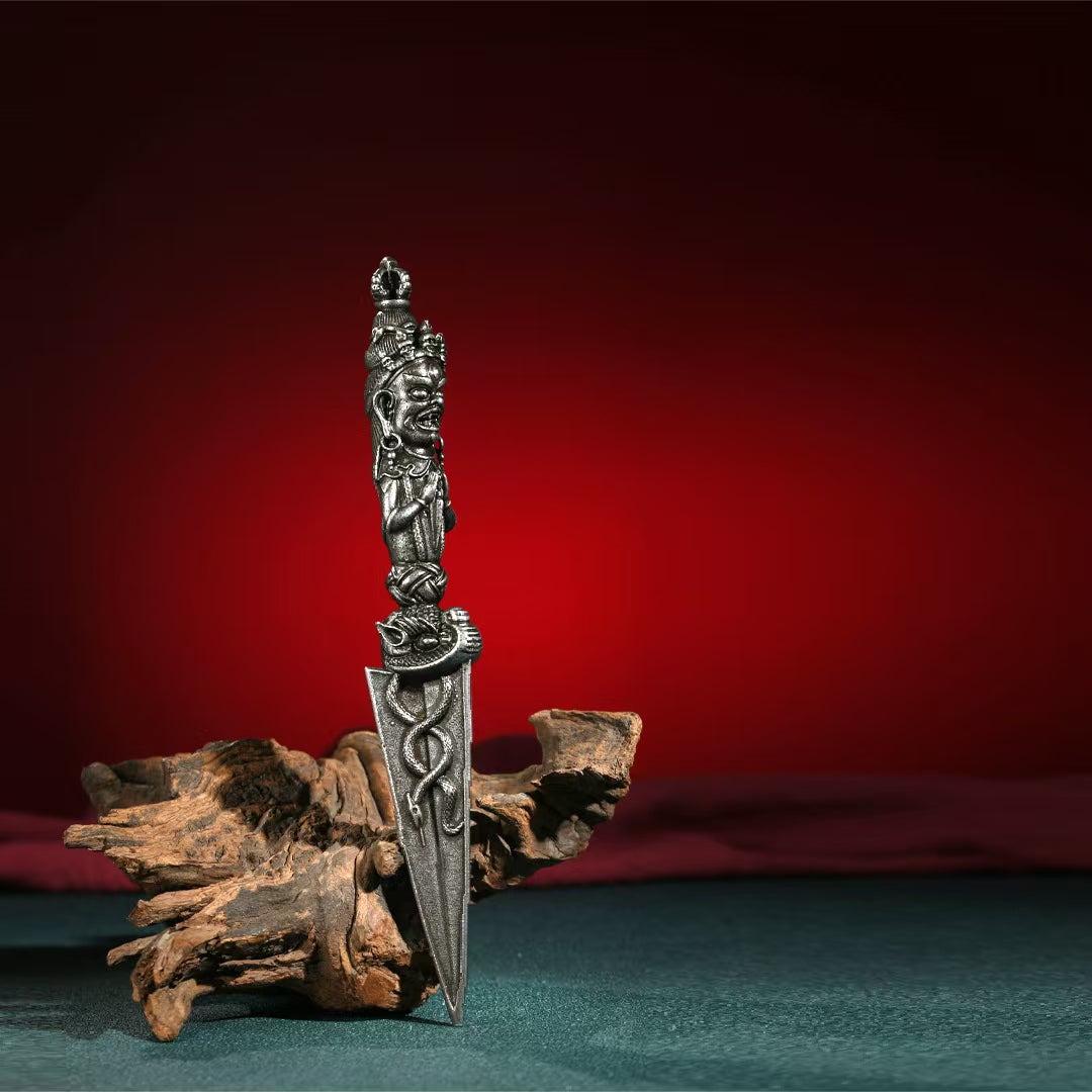 A meticulously handcrafted ritual tool designed to protect and purify. This brass Phurba Vajra combines sacred Tibetan relics for spiritual strength and energy, perfect for your meditation space.