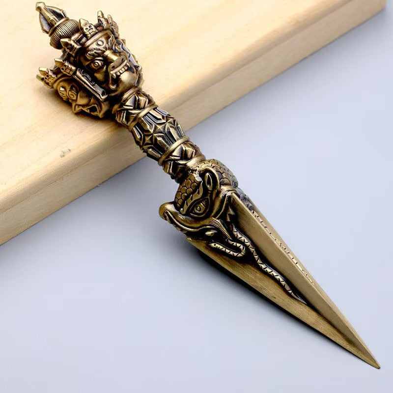 Brass Phurba Vajra with powerful energy crafted in Tibetan Buddhist ritual implements culture, sacred Buddhist ritual implements art for purification and spiritual growth.