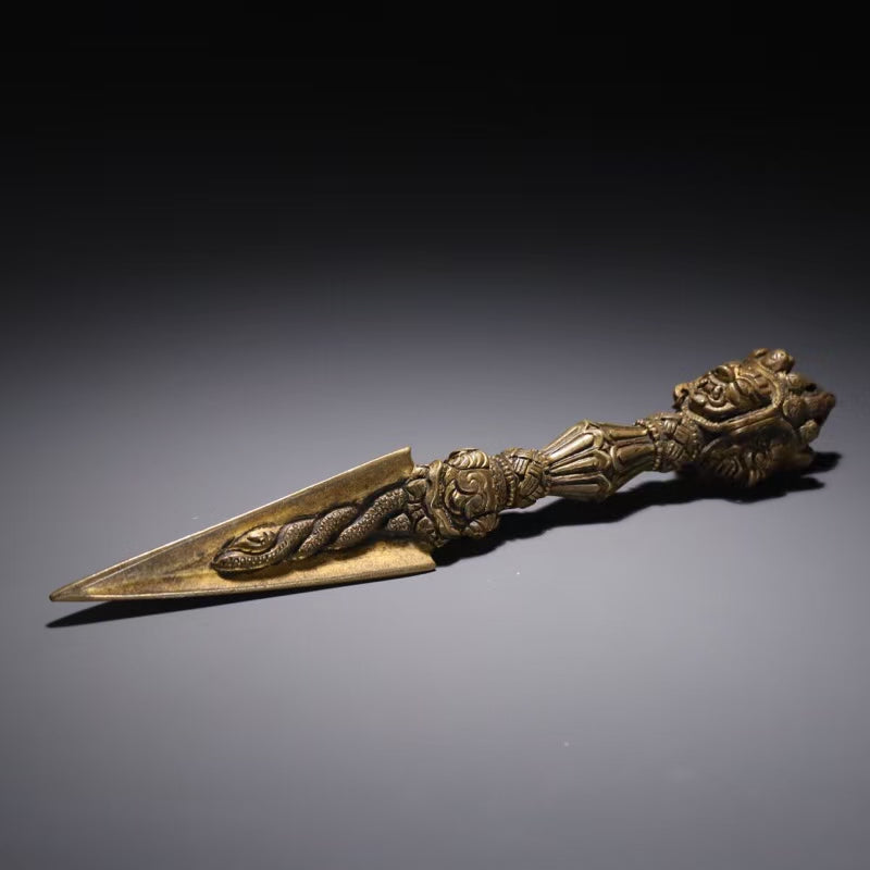 Description: This handcrafted Brass Three-Prong Mahakala Vajra is a powerful Tibetan Buddhist ritual tool used for spiritual protection and purification. Made from high-quality brass, this authentic piece is perfect for meditation, rituals, and enhancing the sacred ambiance of your space. Embrace the spiritual energy of Tibetan Buddhism with this beautiful, meticulously crafted vajra. Ideal for spiritual seekers, practitioners, and collectors.