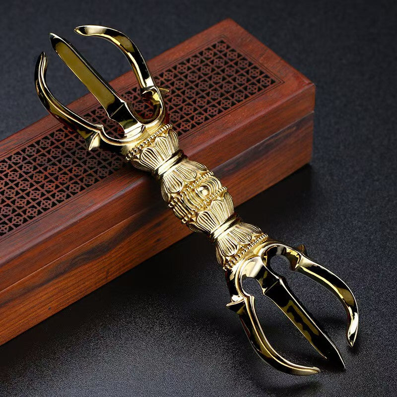 "Handcrafted Brass Three-Prong Vajra, symbolizing spiritual strength and protection in Tibetan Buddhism. Perfect for rituals, meditation, and enhancing your home decor."