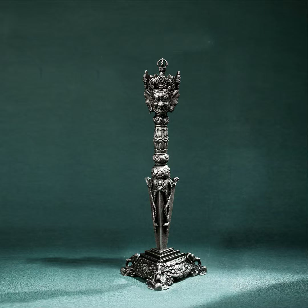 Handcrafted Brass Three-Pronged Phurba with Gessho Flower, a Tibetan Buddhist ritual tool for energy protection and spiritual purification, perfect for altars.