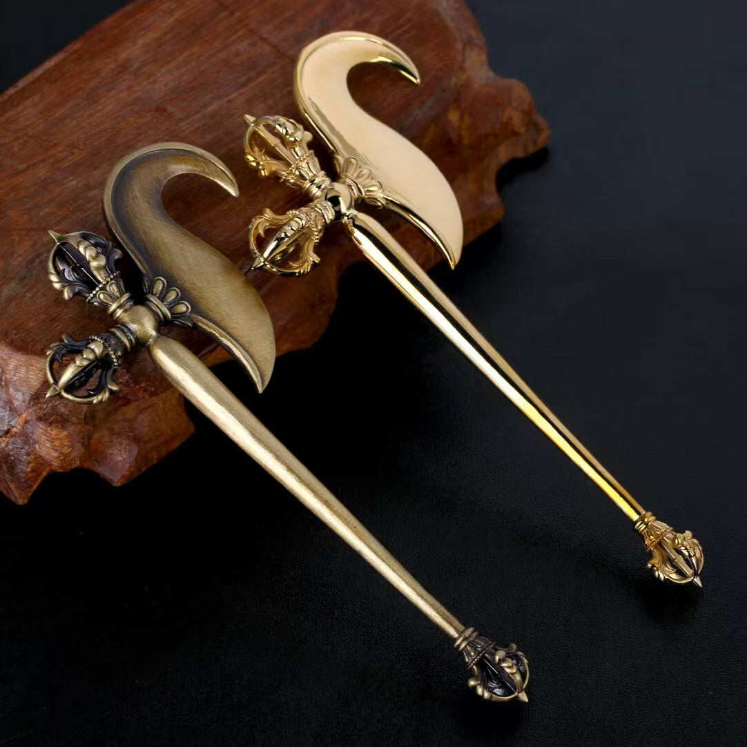 A beautifully handcrafted brass Vajra hook, a ritual tool symbolizing wisdom, strength, and protection in Tibetan Buddhist practices. Perfect for spiritual rituals