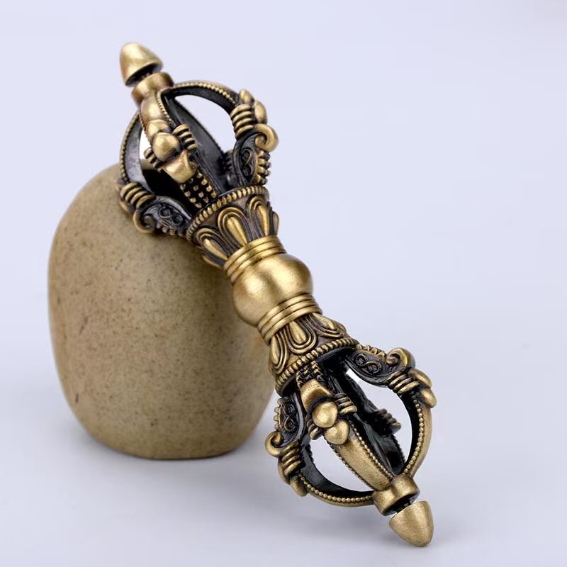 Brass Nine-Pronged Vajra, handcrafted as a spiritual art and ritual tool for purification, wisdom, and protection. Perfect for Buddhist rituals, meditation, and sacred spaces.