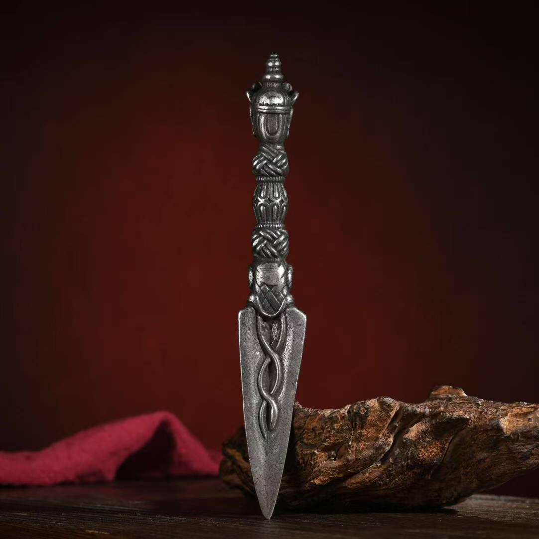 Brass Vajra Phurba, handcrafted for Tibetan rituals, symbolizing strength, protection, and spiritual purification. Ideal for rituals and sacred spaces.